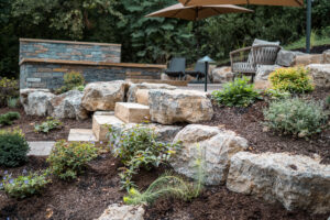 patio oasis with rock wall