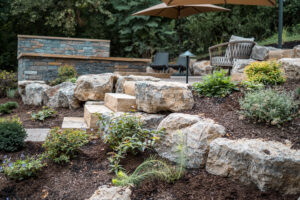 patio oasis with rock wall
